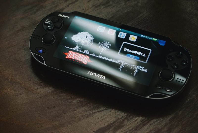 close-up, downwell, wooden, smart phone, table, psvista, western script, motor vehicle, wireless technology, electrical equipment, ps, no people, mobile phone
