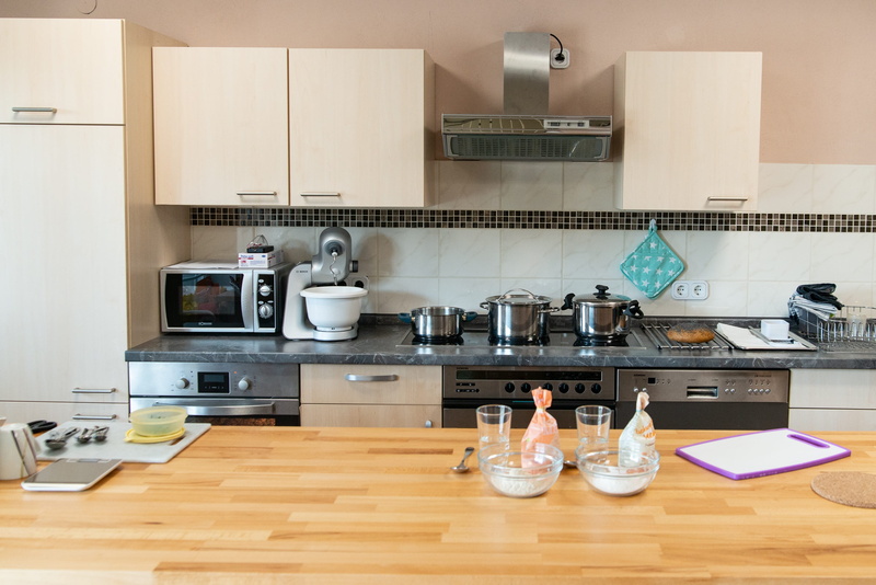 apartment, home, home interior, kitchen counter, kitchen, oven, exhaust fan, technology, table, domestic kitchen, food and drink, no people, household equipment