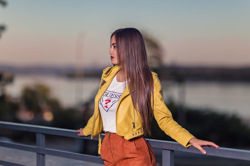 profile, casual clothing, looking away, 1080P, young adult, yellow jacket, outdoors, railing, adult, hair, real people, bridge - man made structure, women outdoors