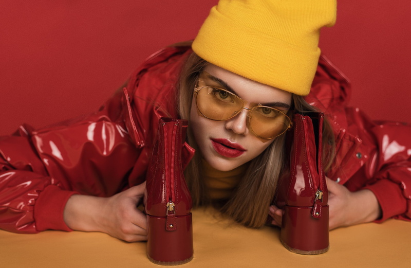 clothing, sitting, young women, emotion, beautiful woman, red lipstick, holding, women with glasses, one person, young adult, hand, frustration, glasses