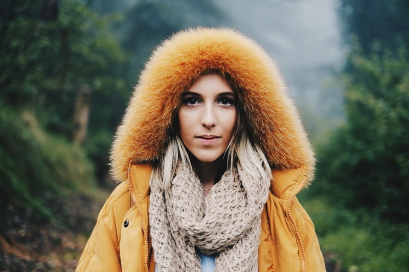 forest, clothing, 720P, coat, hairstyle, hoods, looking at camera, one person, warm clothing, young adult, standing, hair, fur coat, scarf, women, lifestyles