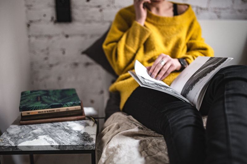 publication, in bed, bedroom, yellow sweater, home Interior, lifestyles, lifestyle, casual clothing, magazine, sofa, clothing, people, 5K, read, women