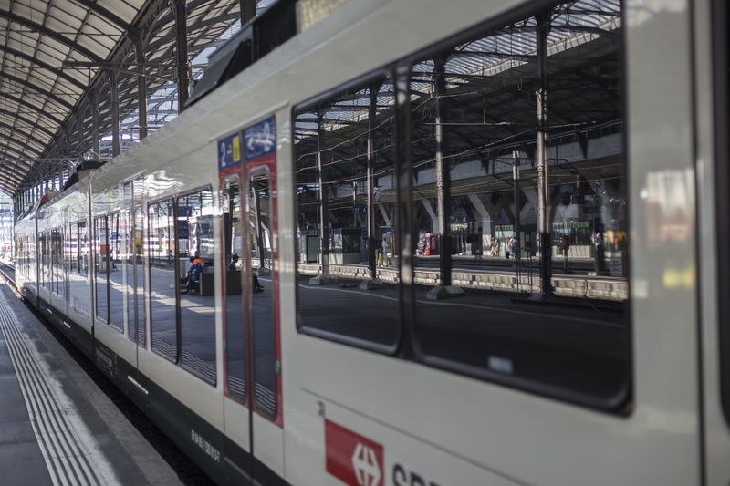 mode of transportation, railroad station, Reflections, railway station, track, subway train, built structure, land vehicle, window, swiss federal railways