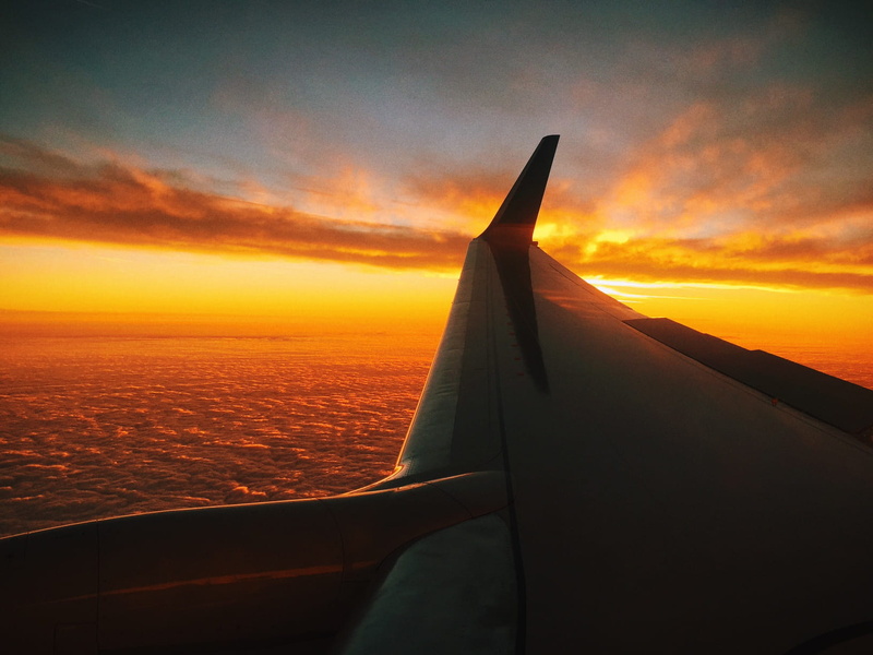 nature, air vehicle, outdoors, clouds, orange color, transportation, sky, mid-air, cloud - sky, sunrise, water, aerospace industry, mode of transportation