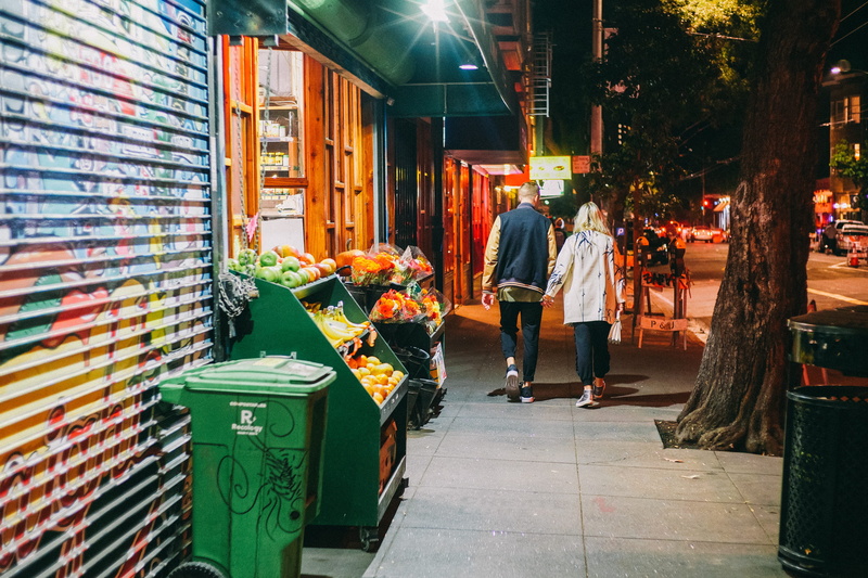 yellow, consumerism, holding, city, illuminated, building exterior, built structure, lifestyles, casual clothing, incidental people, business, man, store