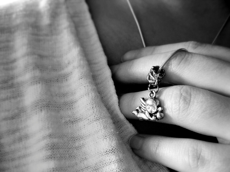 ring, colored, photography, luxury, silver, human body part, grayscale, diamond - gemstone, wearing, close-up, person, pendant, adult, white, love, human hand