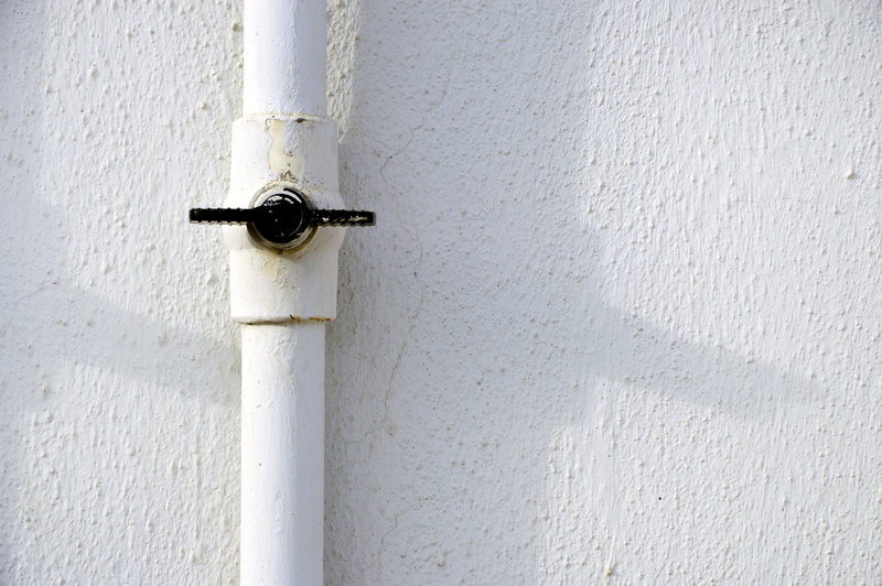 textured, water pipe, ceiling fan, building, black, pipeline, electrical device, connection, pipe - tube, handrail, switch, oars, wall, white color, concrete wall