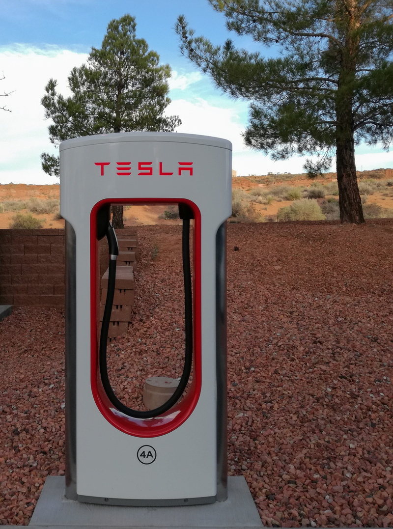 outdoors, land, electric car, nature, communication, no people, plant, western script, tree, loading point, road, sky, scenics - nature, guidance, mobility