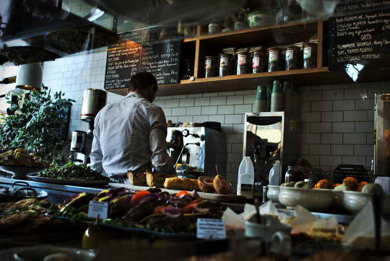one person, man, rear view, cafe, retail display, real people, bar, kitchen, 2K, preparing food, delicious, small business, display, prepared, coffee