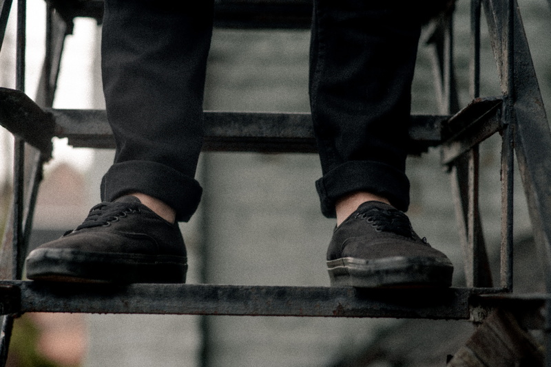 human foot, pair, urban, clothing, authentic, architecture, stair, railing, human leg, body part, wrought, one person, pants, day, lifestyles, human body part