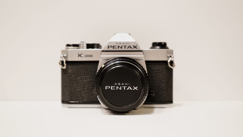 copy space, retro styled, lens - optical instrument, canon, cut out, photography themes, black and white, silver, no people, studio shot, number, film