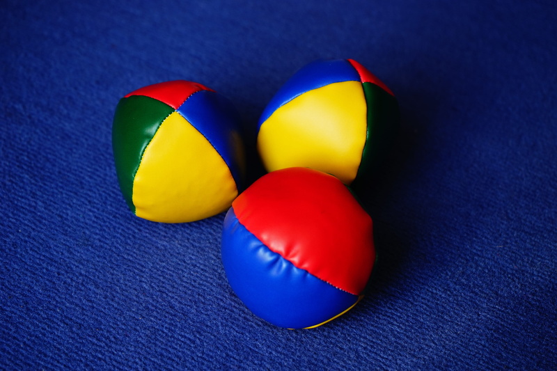 blue background, green, colored balls, still life, balls, colorful, game balls, yellow, assorted, multi colored, textile, group of objects, 3 ball juggling