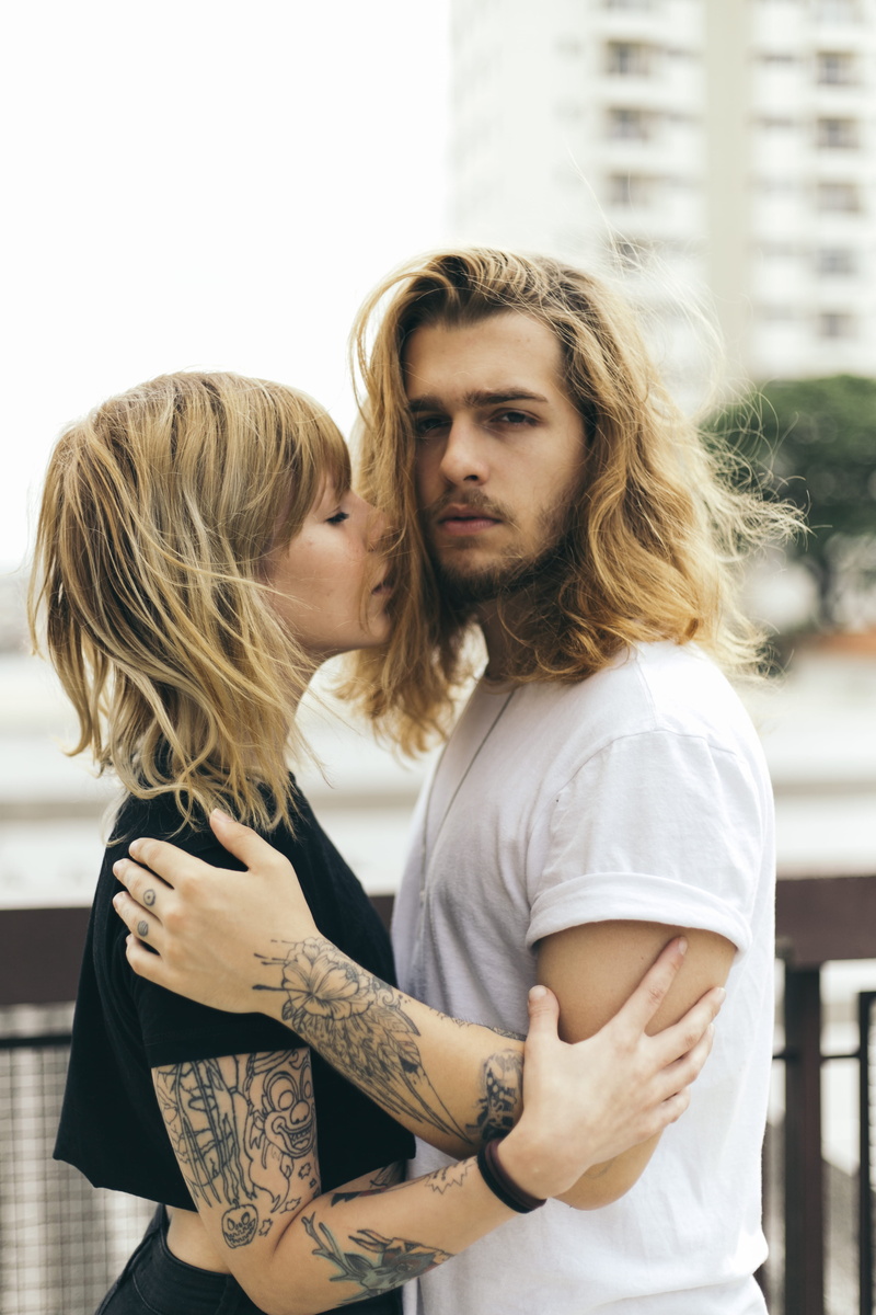 couple, facial expression, two people, togetherness, long hair, young, young men, tattoos, adult, casual clothing, outside, beautiful woman, blond hair