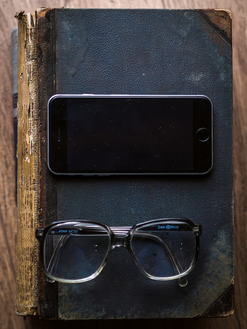 paper, communication, eyewear, glasses, electronic, device screen, phone, table, clock, object, wireless technology, directly above, technology, sunglasses