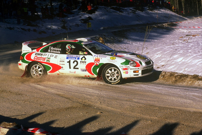 speed, high angle view, transportation, auto racing, shadow, outdoors, day, wheel, motor vehicle, road, racecar, 720P, no people, toyota celica, mode of transportation