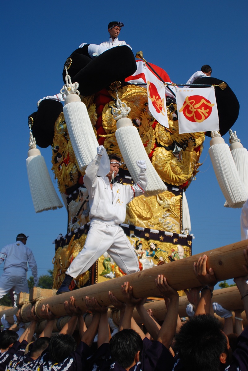 man festival, real people, celebration, mouth shop drum stand, outdoors, drum stand, crowd, sky, adult, religion, group of people, traditional clothing