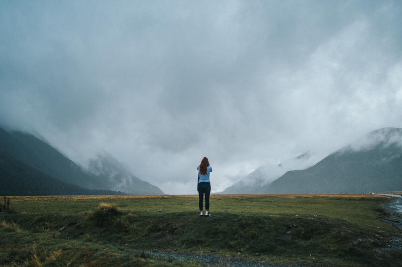 female, gray, person, lady, leisure activity, cloud - sky, mountain, landscape, 4K, looking out, full length, brunette, daytime, misty, standing, land