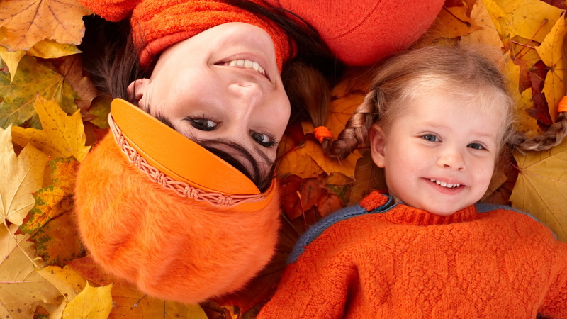 kid, expression, son, looking, father, child, smiling, couple, orange color, innocence, two, lying down, sister, togetherness, boy, emotion, joy, happy