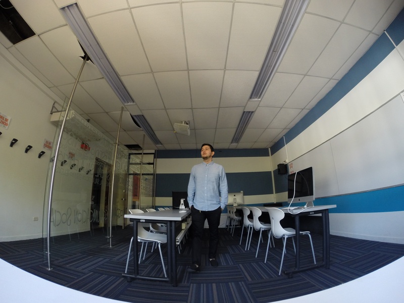 technology, table, one person, real people, adult, indoors, looking at camera, teacher, casual clothing, lifestyles, young men, sitting, chair, university