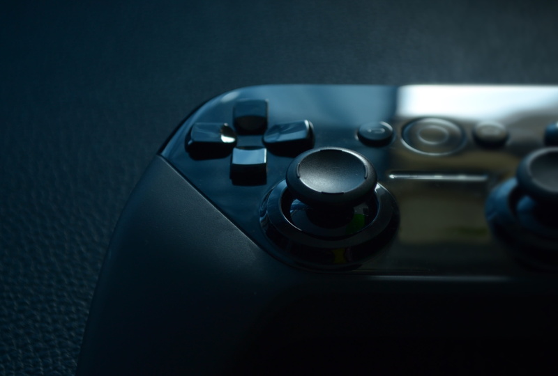 controller, electronics, illuminated, technology, car, selective focus, blur, indoors, joypad, focus on foreground, single object, control panel, no people