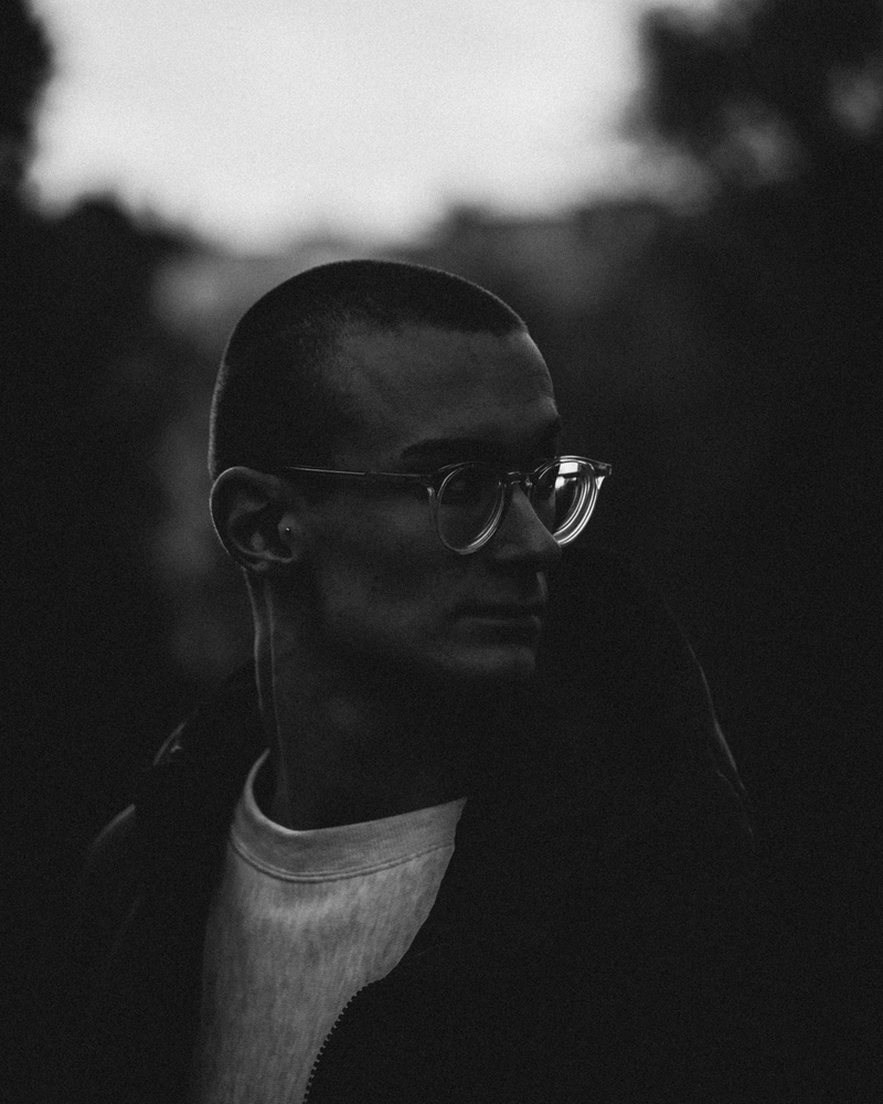 young men, sleeve, apparel, real people, lifestyles, clothing, human face, head, males, face, grayscale, day, person, eyeglasses, photography, one person