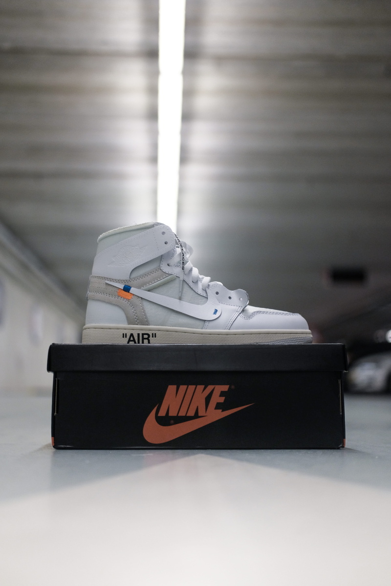 floor, text, alloy wheel, footwear, publication, overcoat, machine, suitcase, western script, hardwood, sport, luggage, nike, helmet, tire, suit, communication