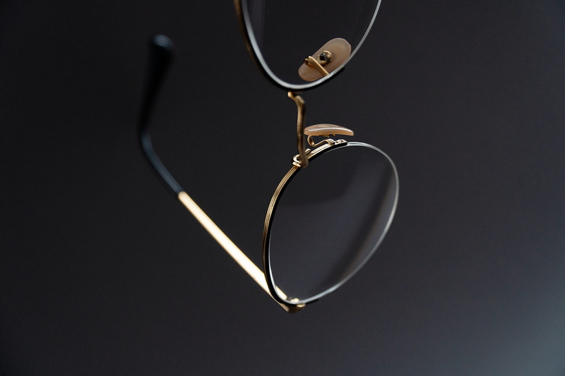 personal accessory, glasses, love, close-up, indoors, elegant glasses, gemstone, ring, two objects, black color, handle, luxury, black background, metal