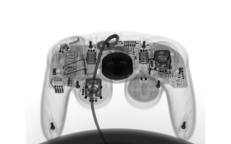 2K, text, household equipment, close-up, machinery, indoors, number, electrical equipment, x rays controllers video games gamecube, single object, connection