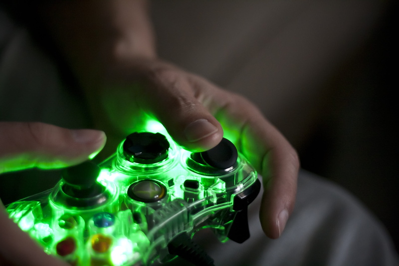 mature adult, technology, selective focus, close-up, arts culture and entertainment, person, play, indoors, finger, controller, joystick, males, men, adult