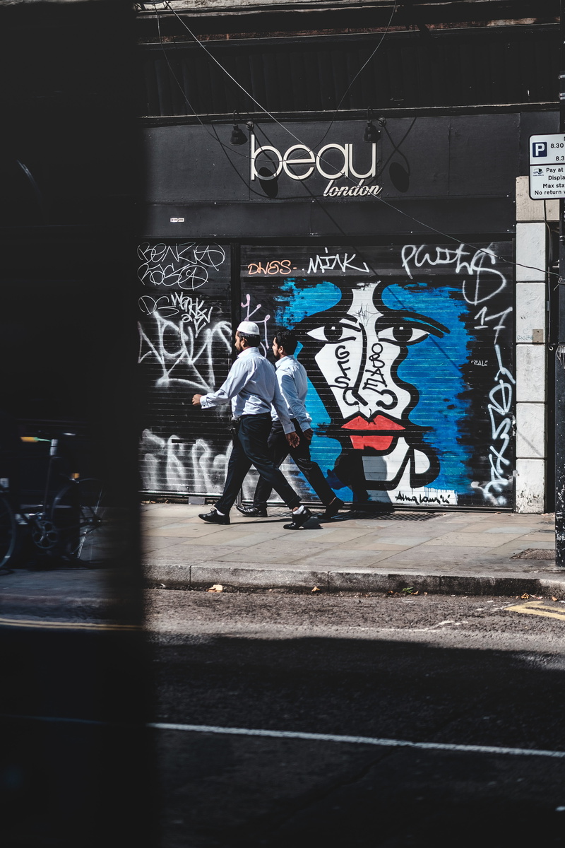 sunlight, parking, 5K, london, real people, architecture, walking, doorway, wall - building feature, representation, creativity, space, full length, sign