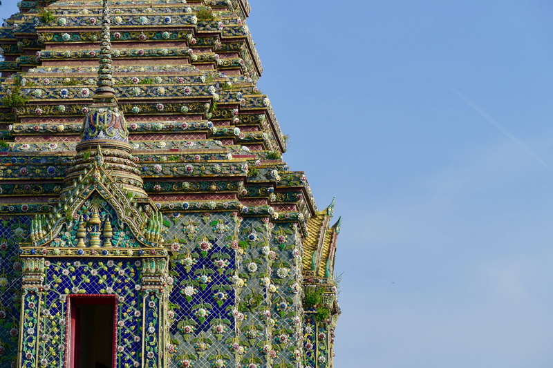 wat pho, place of worship, blue, building exterior, tower, clear sky, floral pattern, historic building, religion, the past, low angle view, nature, temple