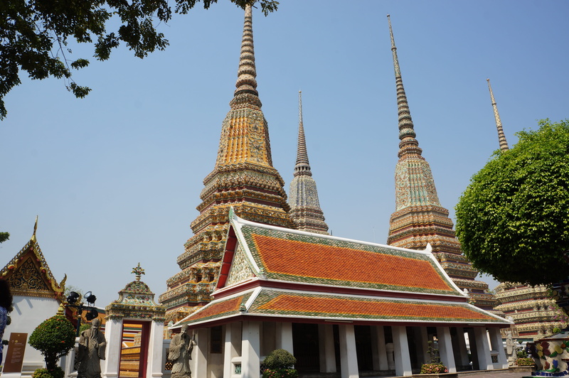 spirituality, bangkok, sky, spire, clear sky, travel destinations, belief, building exterior, tree, no people, nature, low angle view, thailand, place of worship