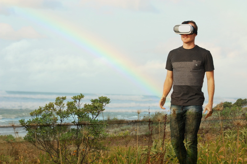 technology, rainbow, sea, cloud - sky, tranquility, landscape, real people, beauty in nature, ocean, standing, one person, person, scenics - nature, casual clothing