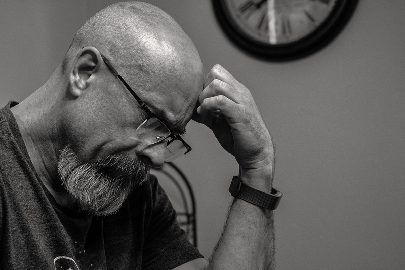 front, profile view, headshot, man, portrait, shaved head, mustache, wear, beard, facial expression, 2K, indoors, depression - sadness, human face, mid adult