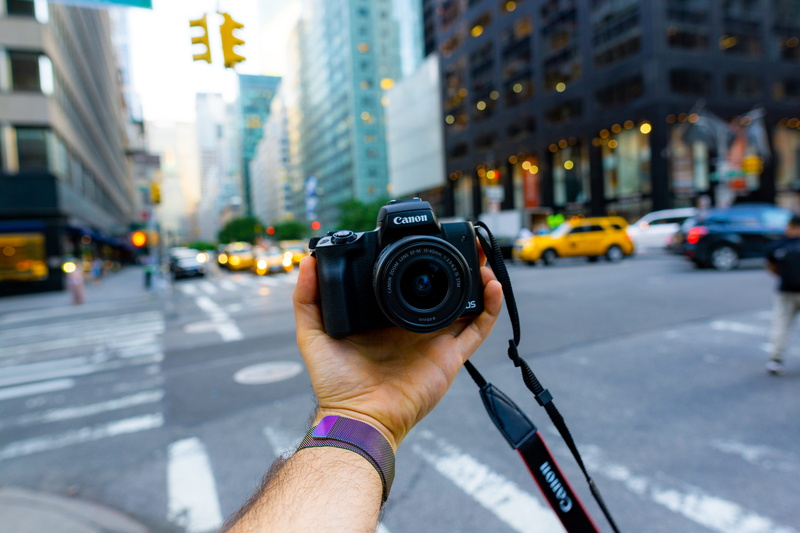 street photo, holding, color Image, photographer, hobbies, selfie, street photography, m50, outdoors, camera, street, modern, dslr, street view, hand, men