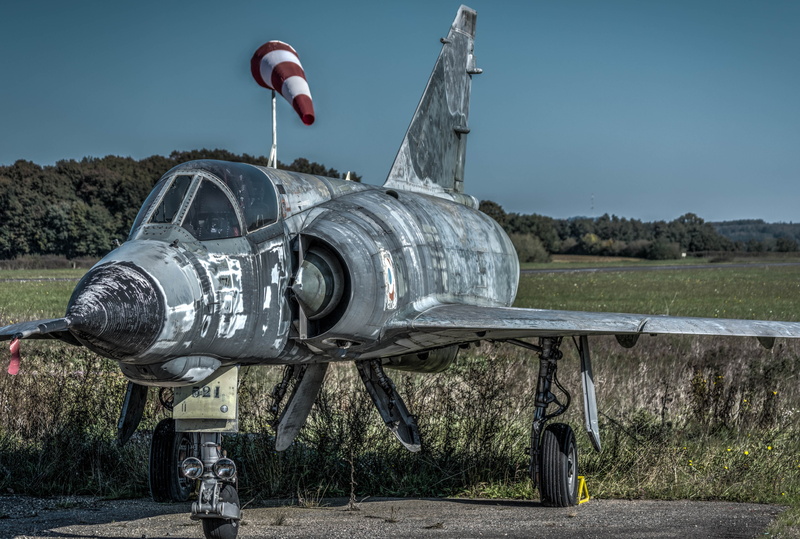 outdoors, blue, air vehicle, metal, plant, sunlight, transportation, road, land, nature, aerospace industry, field, tree, no people, landscape, technology