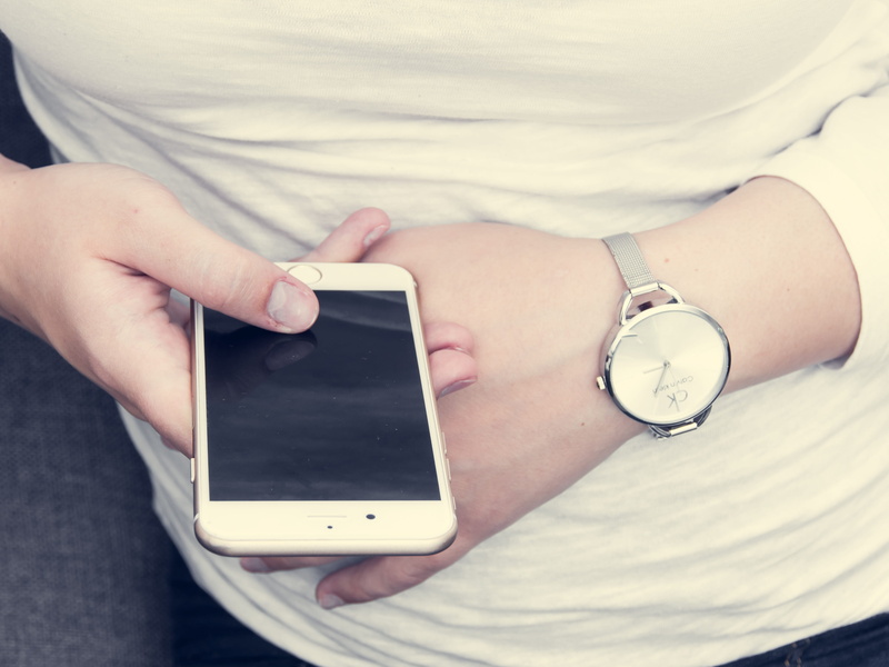 wristwatch, iphone, lifestyles, holding, device, screen, app, business, person, smartphone, personal accessory, apple, white, time, texting, people, social