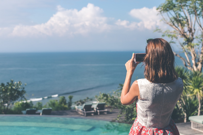 one person, camera, cellular telephone, smartphone, daytime, mobile phone, taking photo, sleeveless, female, real people, scenics - nature, hairstyle, cellphone