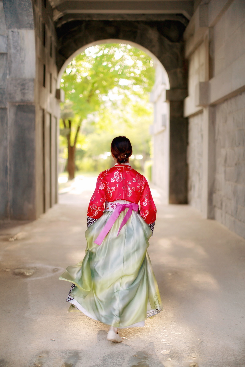 building, grey, belief, outdoors, dress, clothing, asian, women, arch, lifestyles, traditional, establishment, woman, red, religion, real people, adult