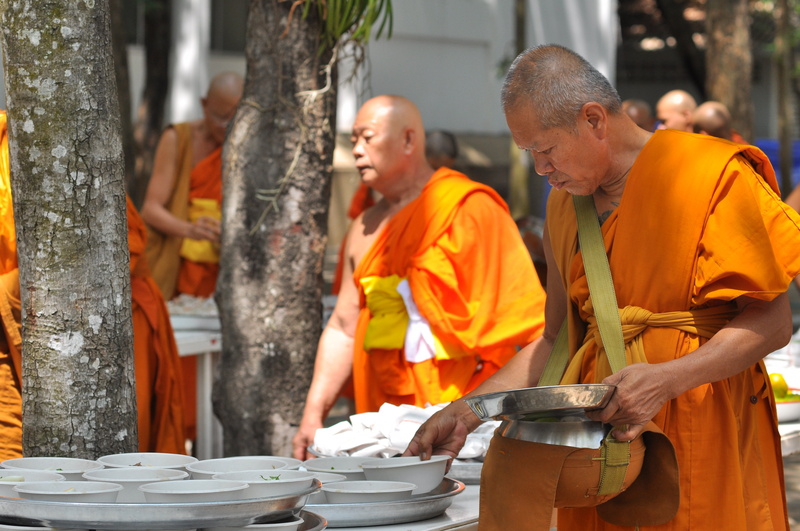 buddhists, working, mature adult, side view, males, buddhism, real people, two people, the english, mature men, alms, standing, business, people, cooperation