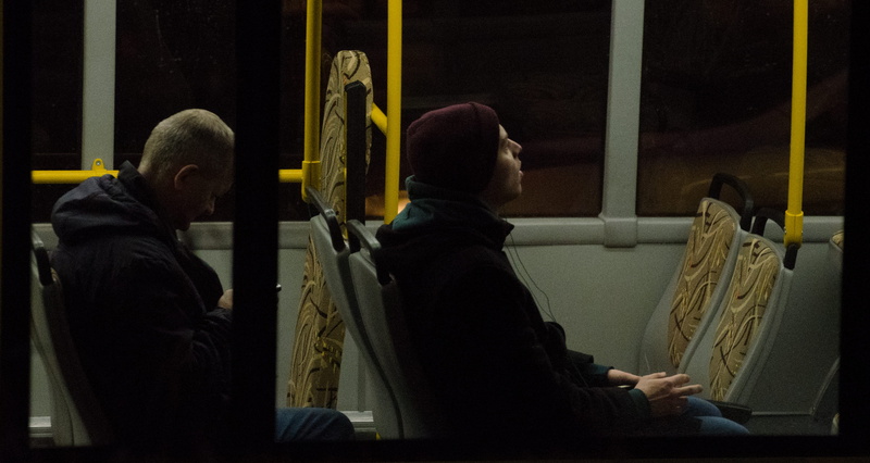 seat, working, chair, musician, indoors, casual clothing, person, profile view, room, people, apparel, waist up, shaved head, building, adult, city bus