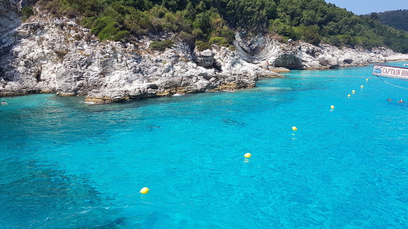 land, rock, outdoors, sailboat, travel destinations, solid, water, turquoise colored, nature, rock formation, paxos, holiday, day, scenics - nature, trip