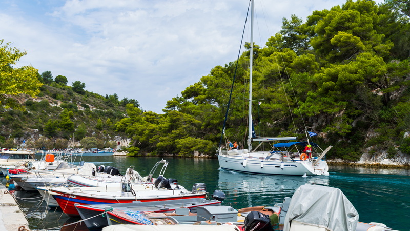 incidental people, cloud - sky, paxoi, water, tourist, green color, nature, tree, transportation, blue, ship, green water, day, sky, scenics - nature, waterfront