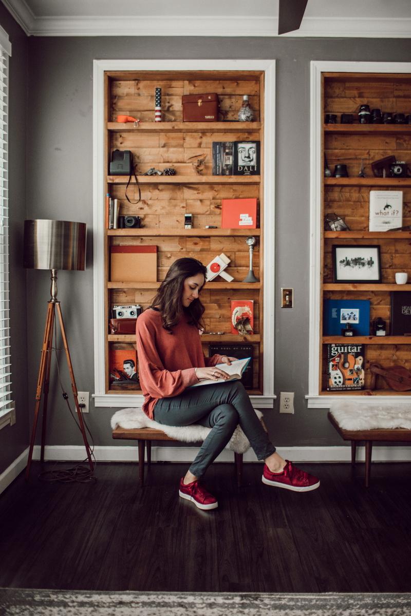 relaxation, one person, book, bookshelf, full length, leisure activity, camera, girl, inside, casual clothing, 5K, music, reading, wood, side view, women