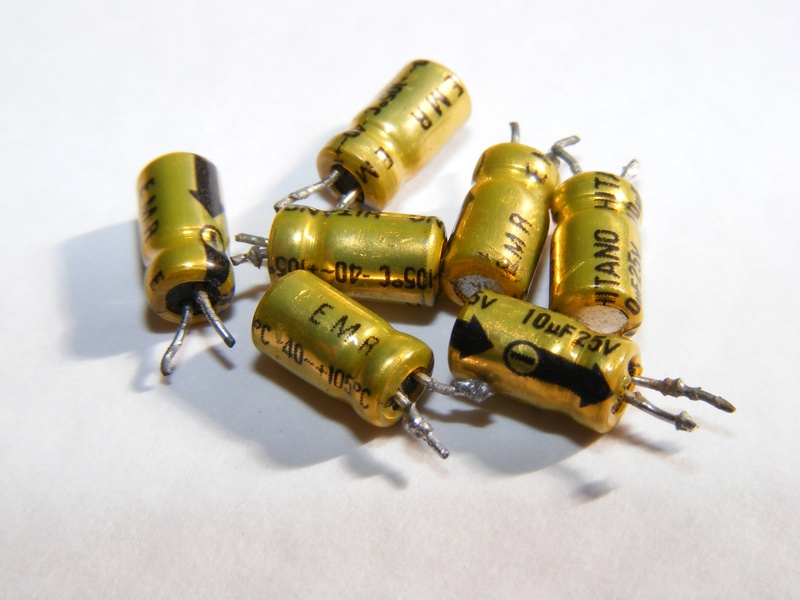 metal, white background, capacitors, gold colored, technology, gold, high angle view, no people, close-up, number, connection, cut out, shadow, electronics
