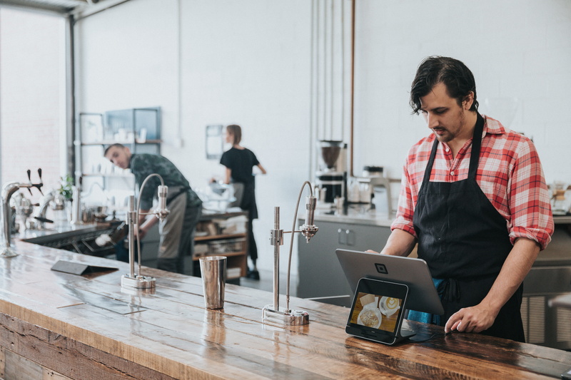 communication, mid adult, using laptop, bakery, young adult, laptop, coffee shop, people, pos, person, lcd screen, wood, point of sales system, males, adult
