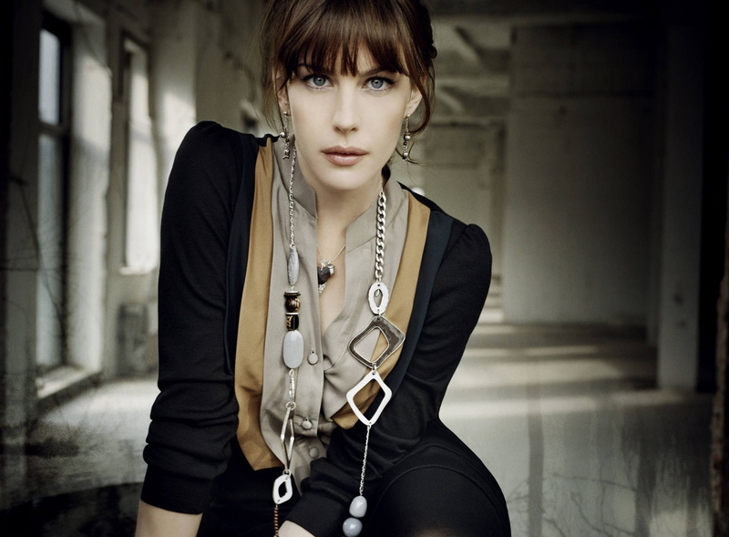 young women, focus on foreground, jewelry, young adult, dress, looking at camera, necklace, beautiful people, Liv Tyler, Tyler, front view, portrait, gray