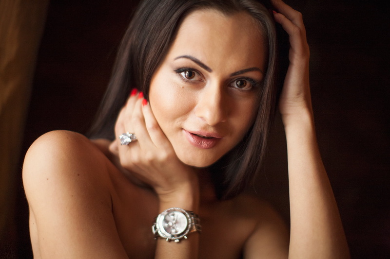 adult, indoors, luxury, hand, beautiful people, black background, precious gem, beautiful woman, hair, ring, one person, hairstyle, elegance, red nails