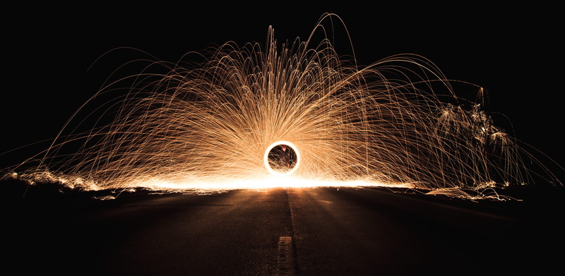 light rain, steel wool, outdoors, night, spinning, one person, fire - natural phenomenon, sign, light, sparks, dark, flame, motion, night photography, lava rain