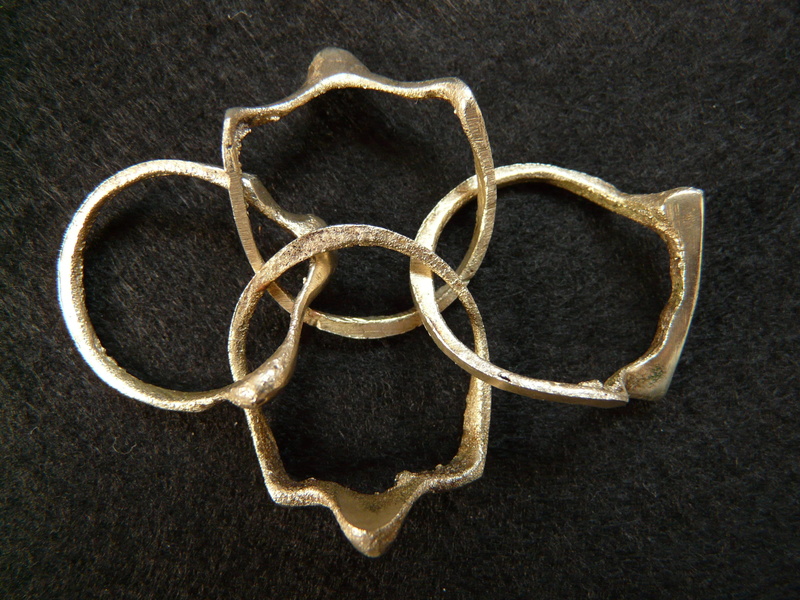 geometric shape, concatenated, ring, four, design, single object, shape, metal, 2K, creativity, no people, positive emotion, directly above, cast iron